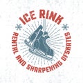 Emblem with hanging retro skates and inscriptions in circle