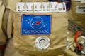 The emblem of Roscosmos on the suit of the astronaut with the ISS. Roscosmos inscription - text on a space suit. Exhibition Days