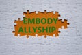 Embody Allyship symbol. Concept word Embody Allyship on white puzzle. Beautiful orange background. Business and Embody Allyship