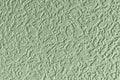 Embossed abstract pattern on a light green paper