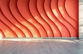 Embossed empty orange wall and floor indoors front view, modern interior. Royalty Free Stock Photo