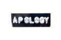 Emboss letter in word apology on black banner with white background Royalty Free Stock Photo