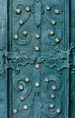 Embossed metallic green-blue background with baroque details and with buttons metal gold flowers Royalty Free Stock Photo