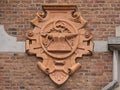 Bas relief of metalworking tools, detail of historical building in eclectic style in Ghent