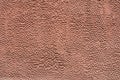 Embossed texture brown cement wall Royalty Free Stock Photo