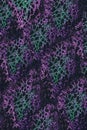 Abstract textile with spot texture: fuchsia and green lurex on a black background Royalty Free Stock Photo