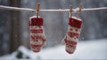 Winter Elegance: Mittens Swaying on a Clothesline Amid Delicate Snowflakes Royalty Free Stock Photo