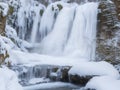 Winter\'s Majesty: Captivating Waterfall in Snow