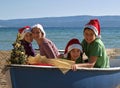 Embraced Christmas family on board Royalty Free Stock Photo