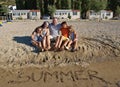 Embraced family on beach in summer