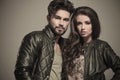 Embraced modern couple in leather jackets smiling Royalty Free Stock Photo