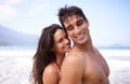 Embracing, beach and portrait of couple on vacation, adventure or holiday for romantic travel. Happy, love and young man Royalty Free Stock Photo