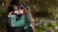 embracing couple in park in sunny autumn day, tenderness and passion of loving people Royalty Free Stock Photo