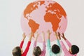 Embracing diversity: children of different ethnicities holding world globe, unity and togetherness Royalty Free Stock Photo