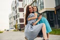 Embracing each other. Young mother with her little daughter walking near the buildings Royalty Free Stock Photo