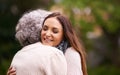 Embracing after a long time apart. an attractive woman and her senior mother hugging outside. Royalty Free Stock Photo