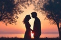 Embracing Love: Silhouette of a Couple Kissing and Holding Hands.