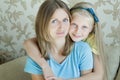 Embracing mother and her teenage daughter family portrait Royalty Free Stock Photo