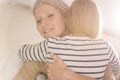 Embracing mother suffering from leukemia