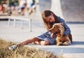 Embracing the pet. Cute little girl have a walk with her dog outdoors at sunny day Royalty Free Stock Photo