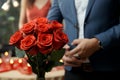 Embracing the romantic surprise, a man presents a bouquet of beautiful roses