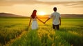 Embracing Serenity, Couple\'s Hand-in-Hand Stroll through a Sunset Field