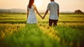 Embracing Serenity, Couple\'s Hand-in-Hand Stroll through a Sunset Field. Generative AI