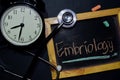 Embriology handwriting on chalkboard on top view. Royalty Free Stock Photo