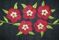 Embroider flower on jeans fabric background