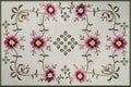 Embroidered  frame, for tablecloth with pinkish-red flowers and buds on wavy branches with small leaves Royalty Free Stock Photo