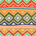 Embroidered ethnic seamless pattern. Aztec and tribal motifs. Striped mexican ornament hand drawn. Green, blue, red, orange and Royalty Free Stock Photo