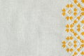 Embroidered fragment on flax by yellow and white cotton threads. Macro embroidery texture flat stitch. Royalty Free Stock Photo