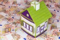 Embroidered house on euro notes Royalty Free Stock Photo