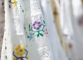 Embroidered peasant blouses, known as romanian traditional blouses. Detail of Colored Ie