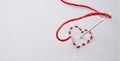 Embroidered red heart on a white cloth with needle punctured Royalty Free Stock Photo