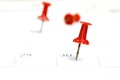 Embroidered red pins on a calendar on the 30th
