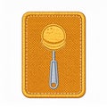 Embroidered Spoon Patch on Textured Yellow Fabric Background Close Up Royalty Free Stock Photo