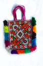 embroidery bag,expensive and valuable embroidery bag,colorful bag,indian embroidery bag,beautiful and valuable bag on white