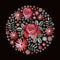 Embroidery. Beautiful round pattern with red roses and other flowers and leaves. Floral composition on black background