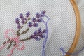 Embroidery bouquet of lavender and tools of needlework