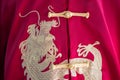 Embroidery chinese dragons on Chinese style red shirt background