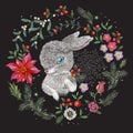 Embroidery christmas pattern with flowers, pine and hare.