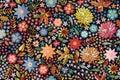 Embroidery. Ditsy floral seamless pattern with colorful flowers and leaves on black background. Beautiful print for fabric Royalty Free Stock Photo