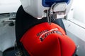 Embroidery machine and sport cap close up picture