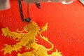 Embroidery machine workspace and gold lion design on red fabric Royalty Free Stock Photo