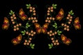 Embroidery of motley butterflies on yellow flowers with twisted stems and green leaves on a black background