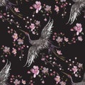 Embroidery oriental seamless pattern with cranes and cherry blossom. Royalty Free Stock Photo