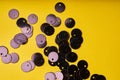 Embroidery products and tools. Black sequins on yellow background