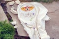 Embroidery project - butterfly on linen cloth in a hoop with a word Moth, made of thread and a few lavender flowers on it.