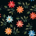 Embroidery seamless patterns with bright colorful flowers and leaves on black background Royalty Free Stock Photo